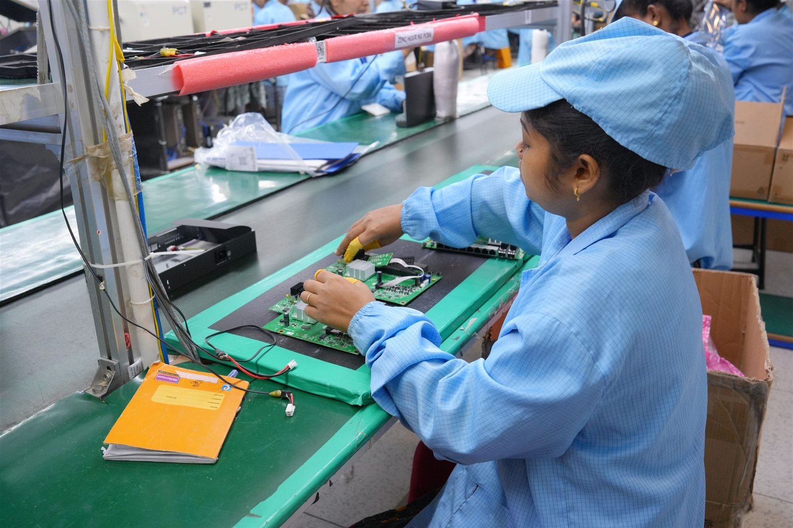 PCT specialist assembling an electronics circuit board