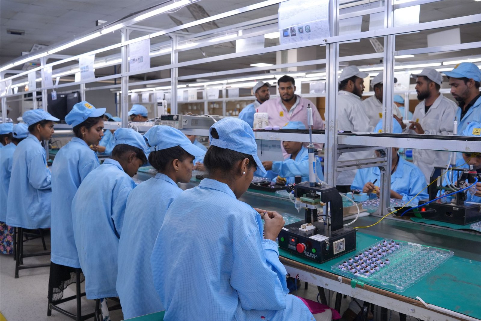PCT production team collaborating on an assembly line